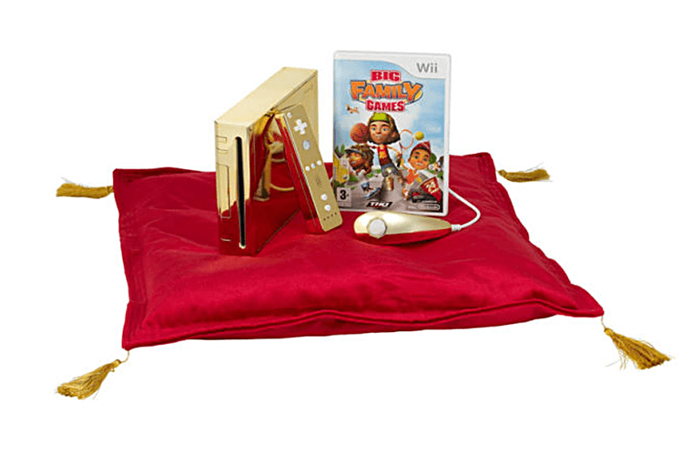 Gold Wii console and Big Family Games on red cusion