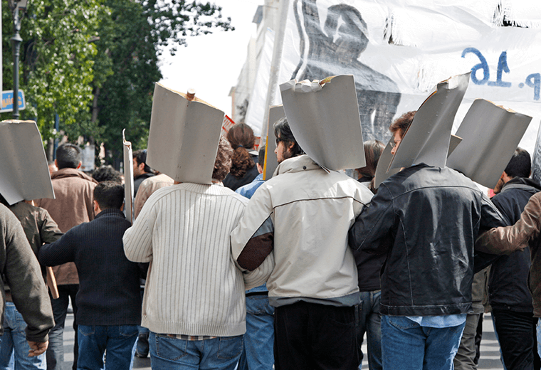 Crowd holding picket signs