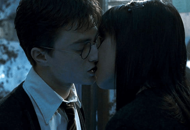 Harry struggled with the ladies until he steals a kiss with Cho.