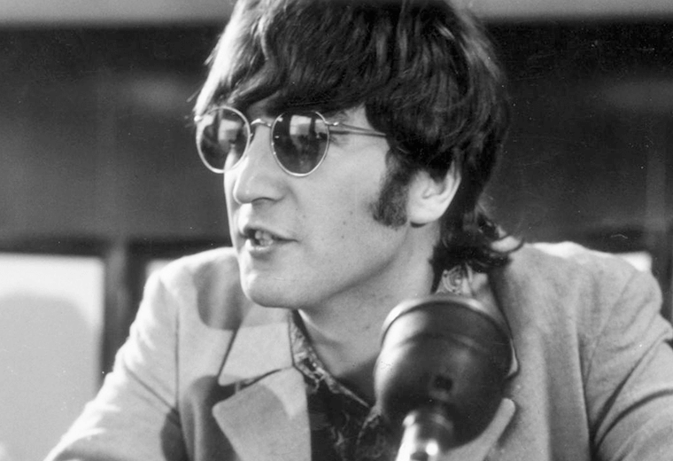 John Lennon wearing his trademark sunglasses