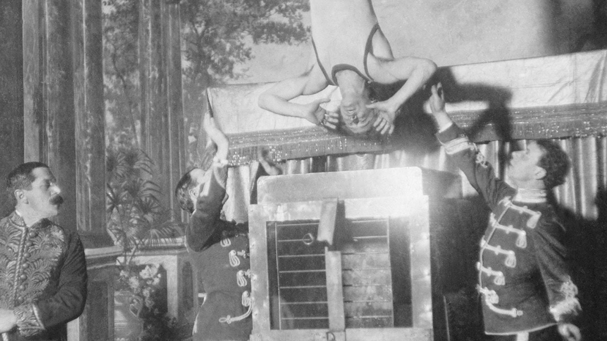 Harry Houdini being lowered into the Chinese water torture cell