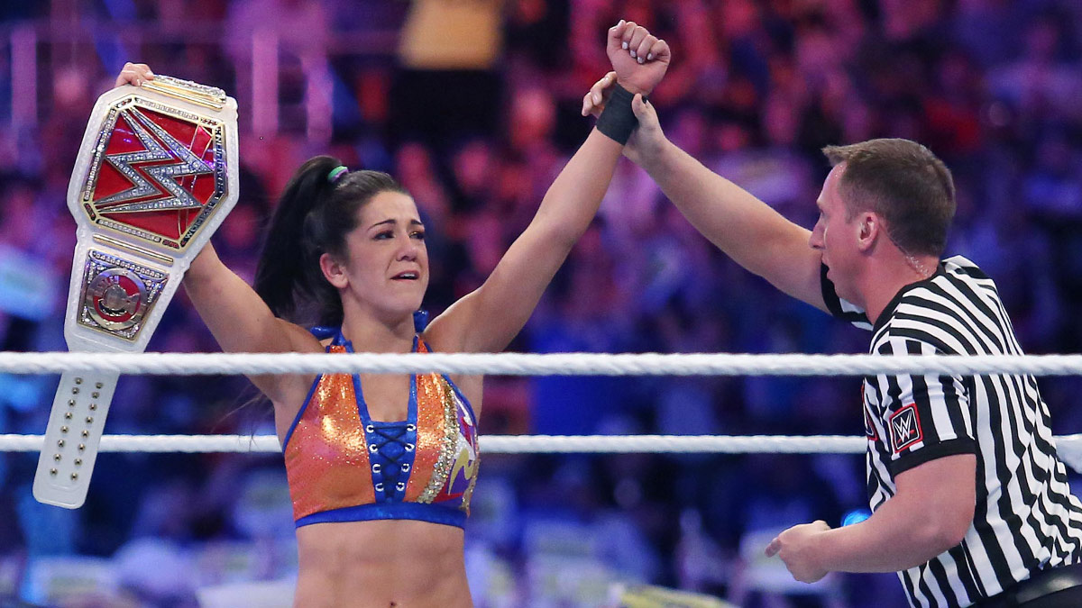 WWE star Bayley holding the championship belt