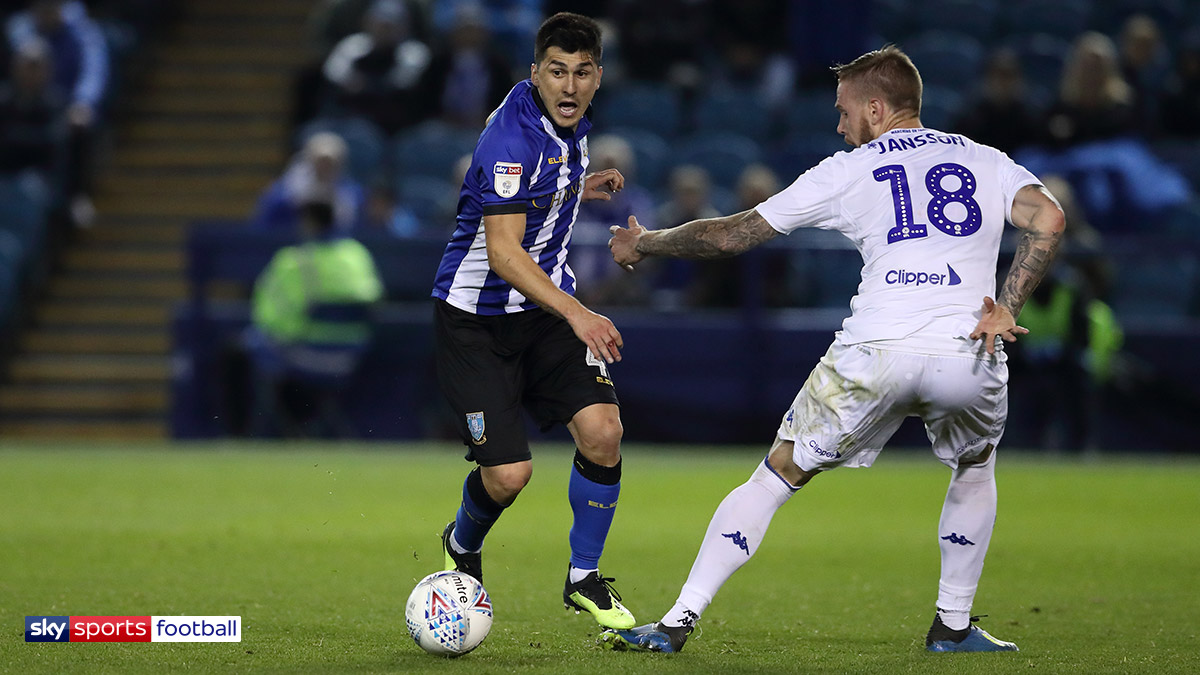 Fernando Forestieri of Sheffield Wednesday and Pontus Jansson of Leeds United