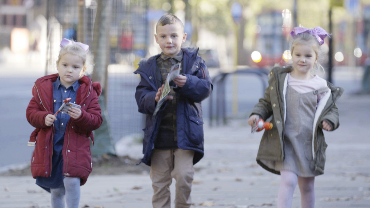 Three children undertaking a task in Planet Child