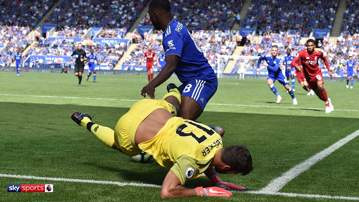 Alisson Becker of Liverpool takes a tumble playing against Chelsea