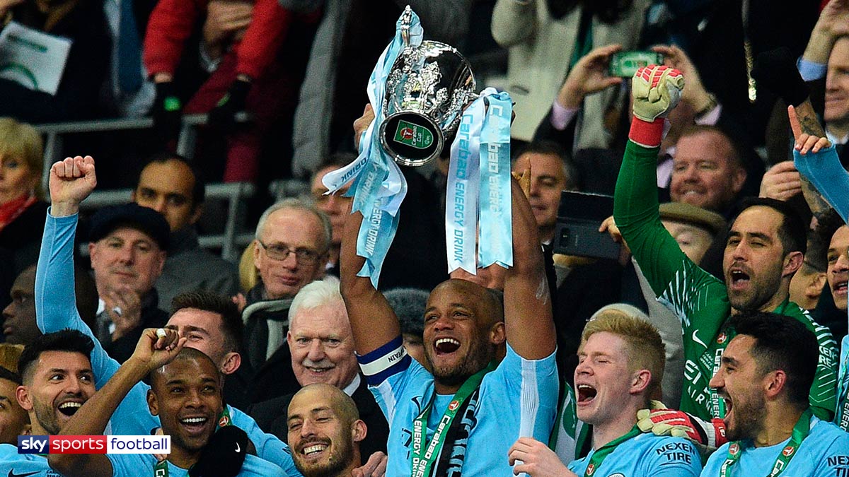 Manchester City players lifting the Carabao Cup