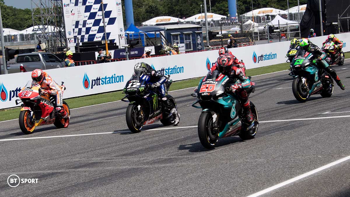 MotoGP riders waiting at the starting grid 