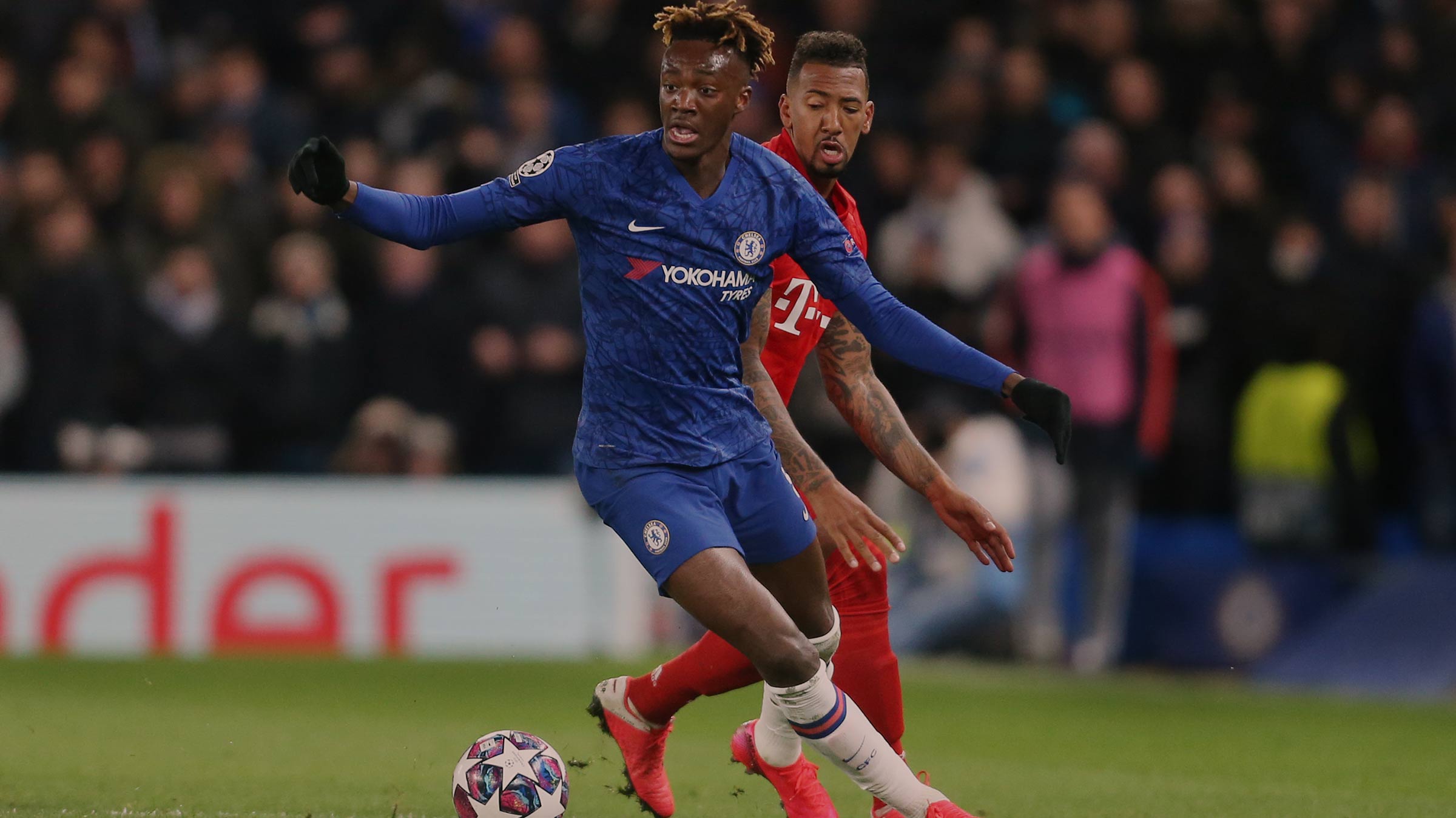 Chelsea’s Tammy Abraham takes on Bayern Munich’s Jerome Boateng in the UEFA Champions League