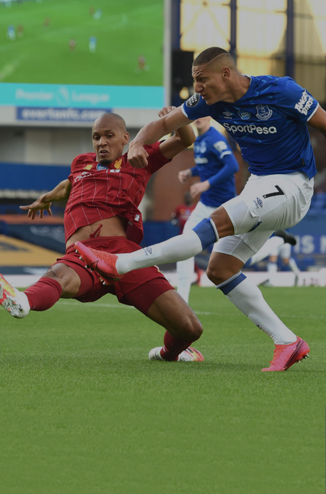 Everton forward Richarlison gets a shot off at Goodison Park with Liverpool’s Fabinho in close pursuit