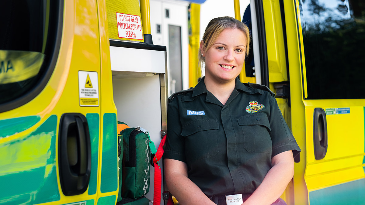 A paramedic standing outside her vehicle in Inside The Ambulance: Wonder Women