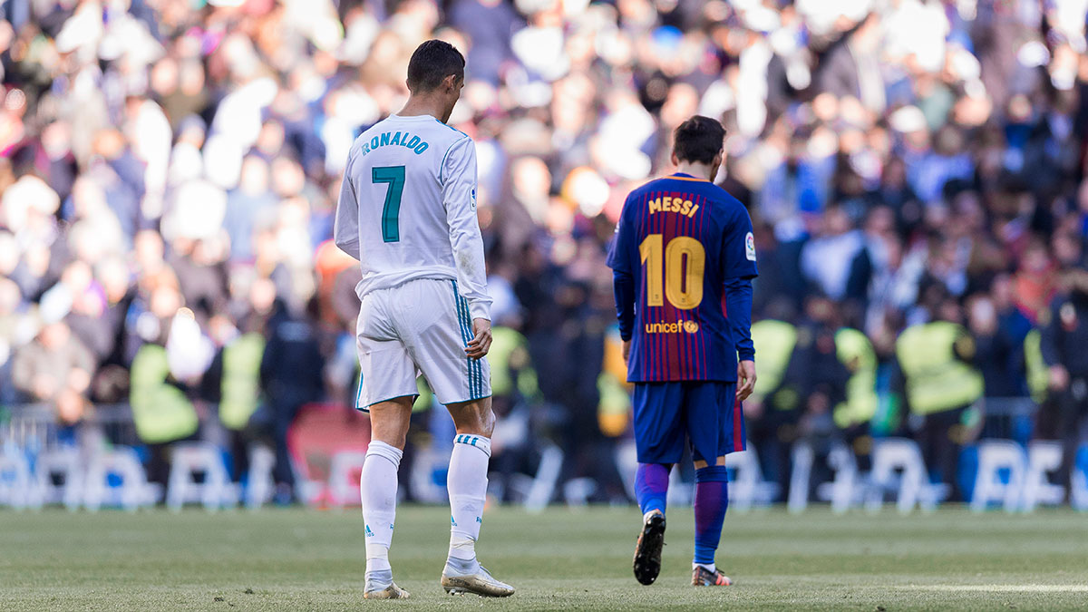 Real Madrid's Cristiano Ronaldo playing against Barcelona's Lionel Messi